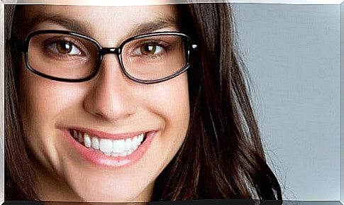 Woman with glasses smiling