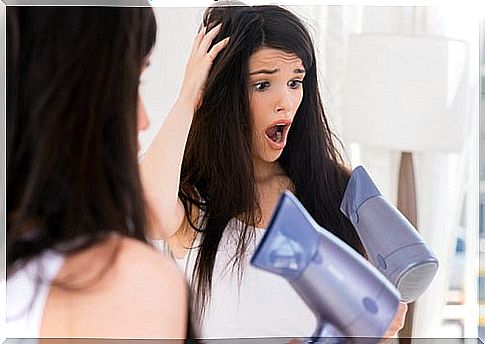 Woman with hair dryer