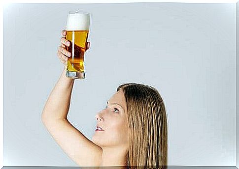 Woman holding beer glass