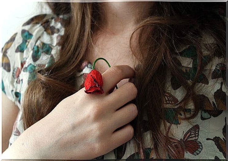 Woman holding rose