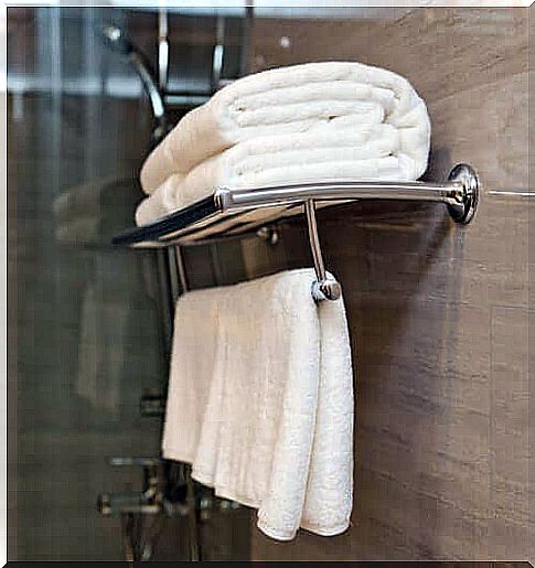 Clean towels hanging in the bathroom.