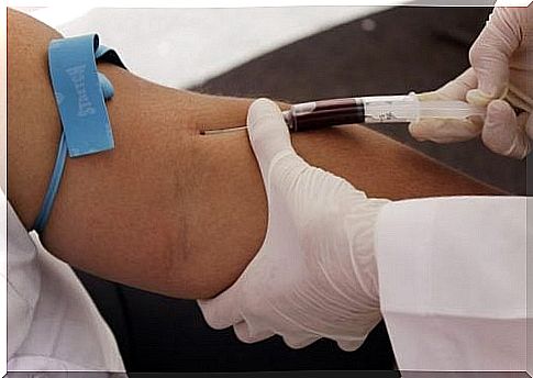 Doctor takes blood sample