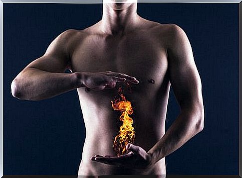 Man with flame in front of stomach