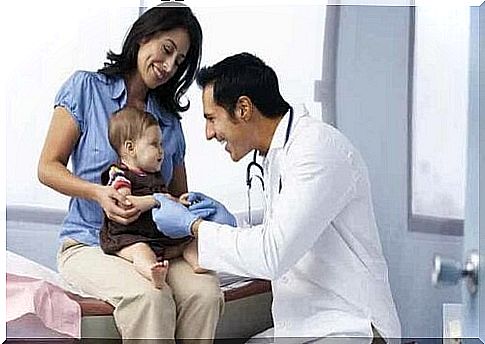 A baby on an examination at a pediatrician.