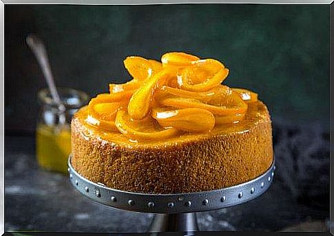 Orange inform cake with garnish.