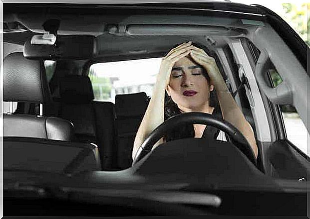 A stressed woman in a car