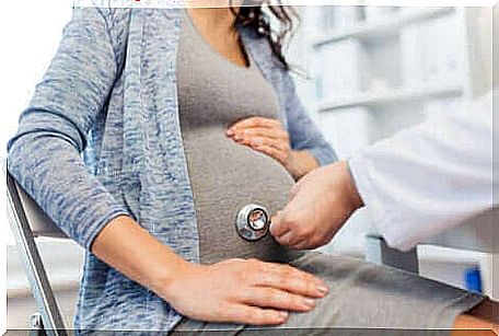 A pregnant woman on a doctor's visit.