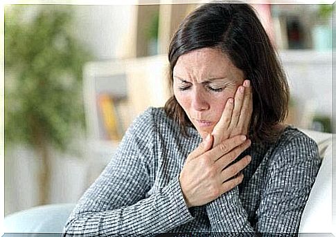 A woman with a toothache.