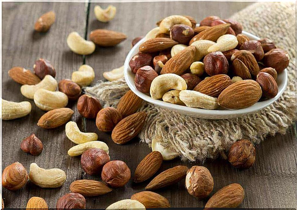 Bowl of nuts on a table, nuts increase the good cholesterol