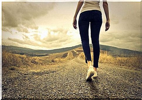 Lady walking along country road