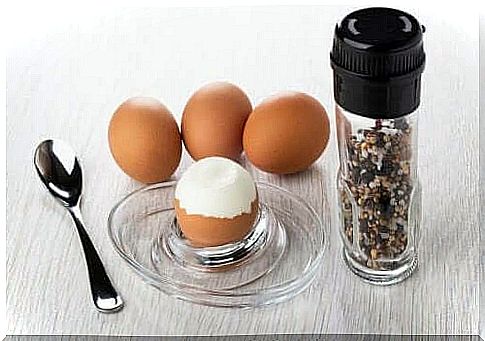 Hard-boiled eggs and a pepper mill.